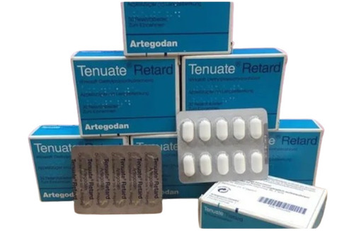 Tenuate Retard pill with healthy meal and scale, symbolizing safe and effective weight loss with appetite suppressants.